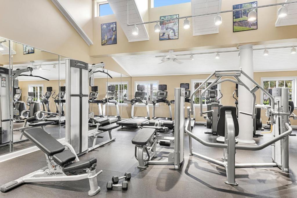 a gym with several treadmills and elliptical machines at Marriott&#39;s Legends Edge at Bay Point in Panama City Beach
