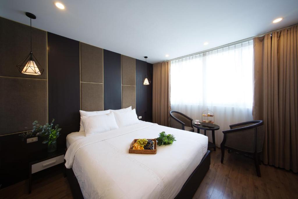 Postel nebo postele na pokoji v ubytování Keypad Hotel - 24 Hang Ga