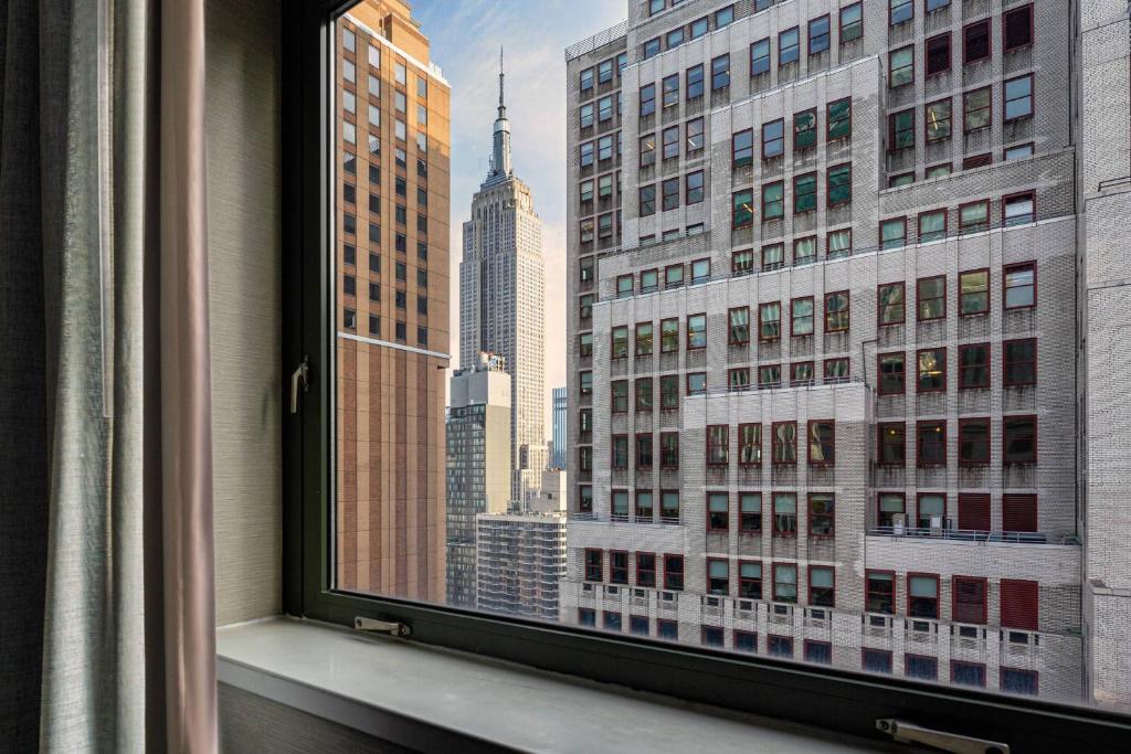 a window with a view of a city skyline at Courtyard New York Manhattan/Times Square in New York