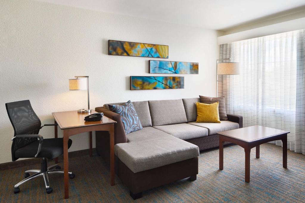 a living room with a couch and a table at Residence Inn by Marriott Killeen in Killeen