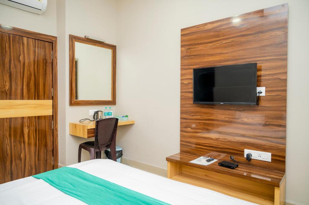 TV a/nebo společenská místnost v ubytování Hotel Green Apple