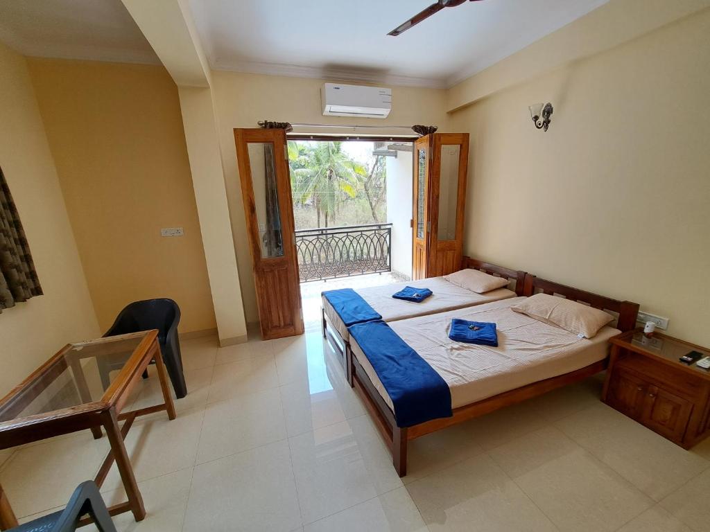 Voodi või voodid majutusasutuse D'souza's Guest House toas