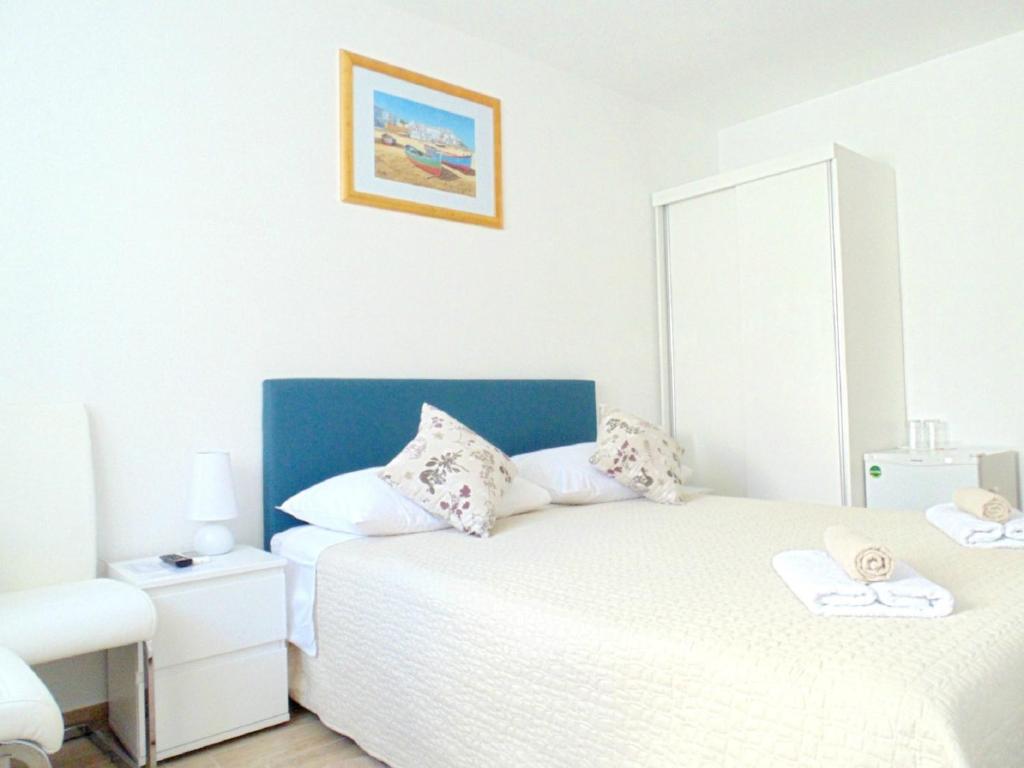 Posteľ alebo postele v izbe v ubytovaní Peruzovic Rooms 1