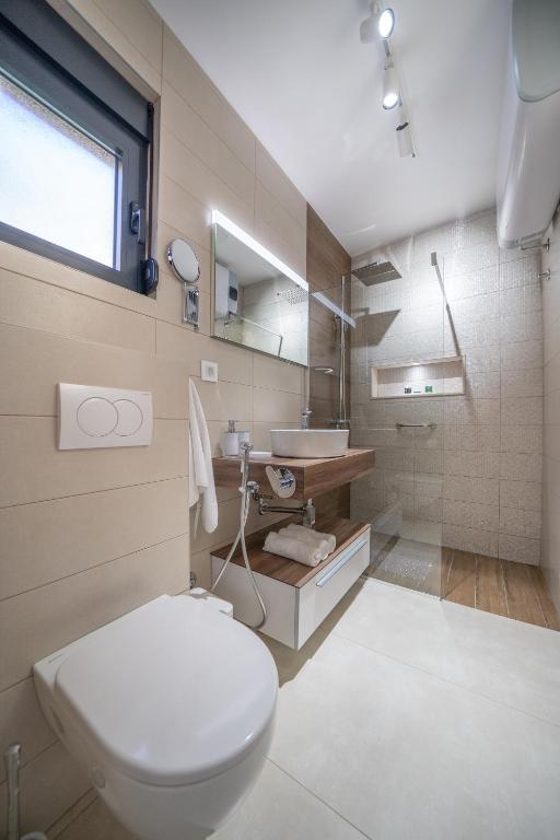 Beige bathroom with walk-in shower