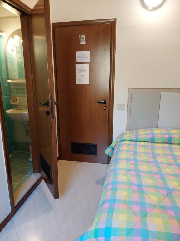 Postel nebo postele na pokoji v ubytování Hotel La Passeggiata