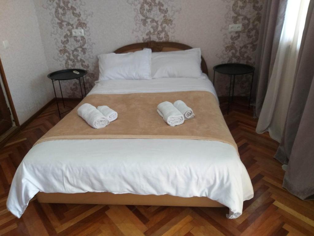 Postel nebo postele na pokoji v ubytování Guesthouse ''Door'' in Sighnaghi