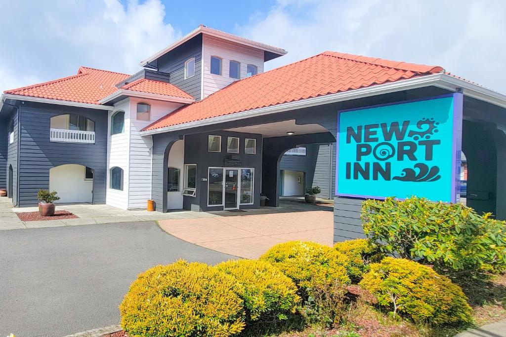 a newport point inn sign in front of a building at Newport Inn By OYO - Hwy 101 in Newport