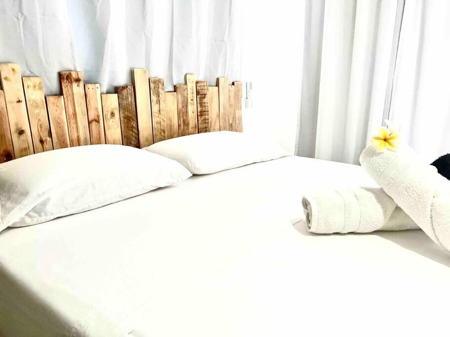 Postel nebo postele na pokoji v ubytování Heitiare lodge