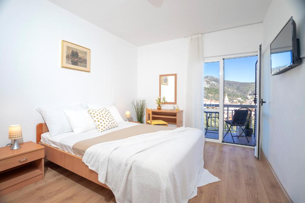 Postel nebo postele na pokoji v ubytování Novak Guesthouse - ZF Hvar