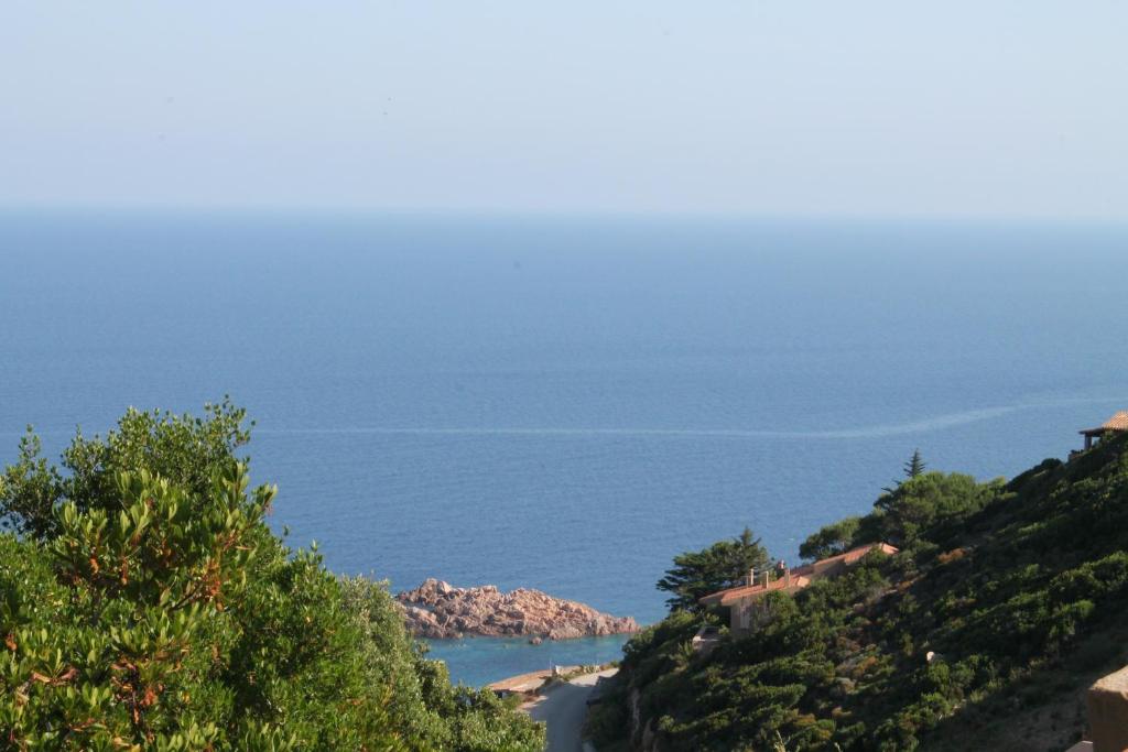 a view of a beach and the ocean at Sardinia Sea Vacation Villa in Costa Paradiso