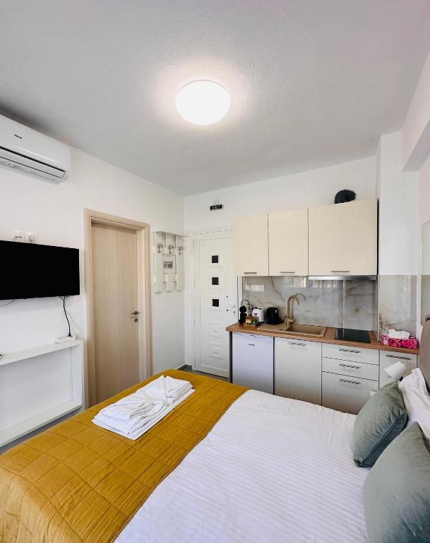 Posteľ alebo postele v izbe v ubytovaní Bella House Nikiti