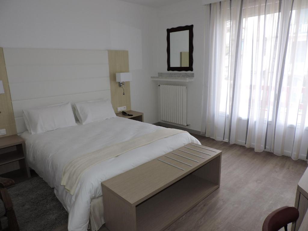 Postel nebo postele na pokoji v ubytování Hotel Uhainak