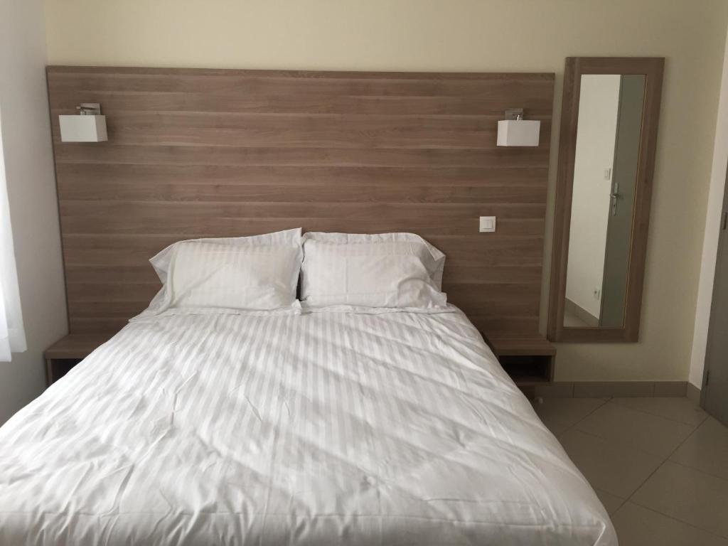 Postel nebo postele na pokoji v ubytování Le Logis Dauphinois