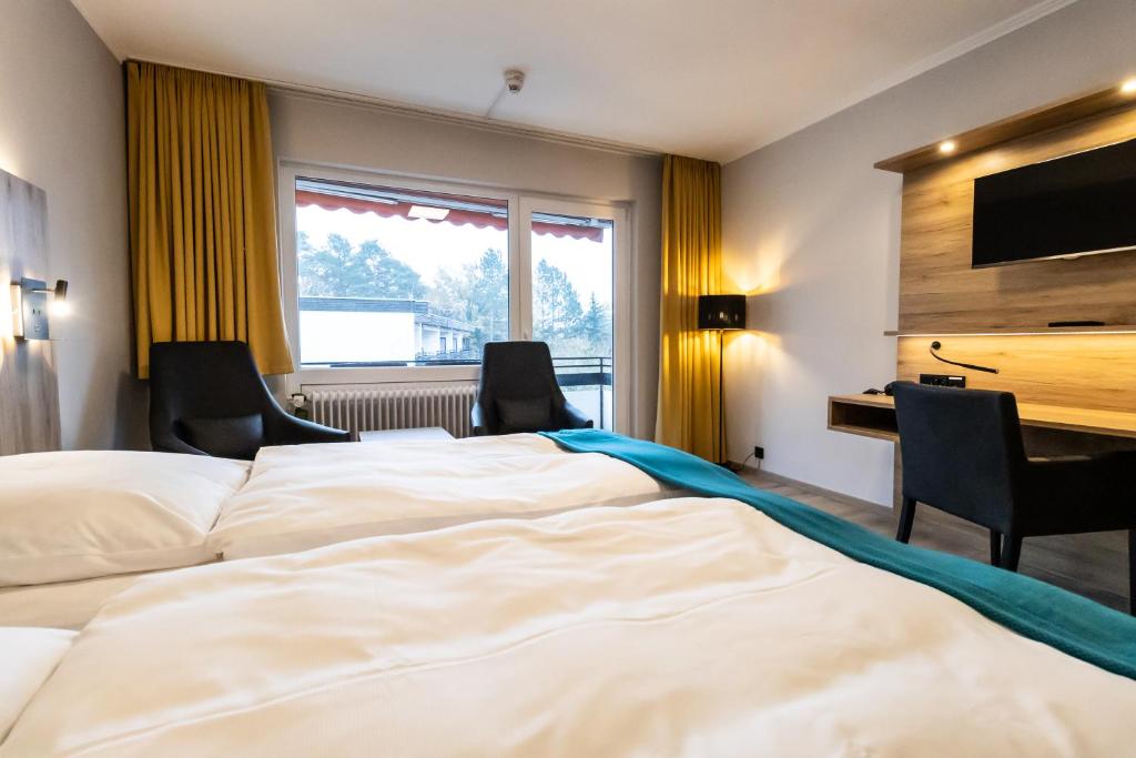Postel nebo postele na pokoji v ubytování VitalHotel Ascona