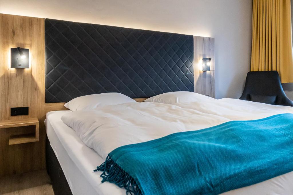 Postel nebo postele na pokoji v ubytování VitalHotel Ascona