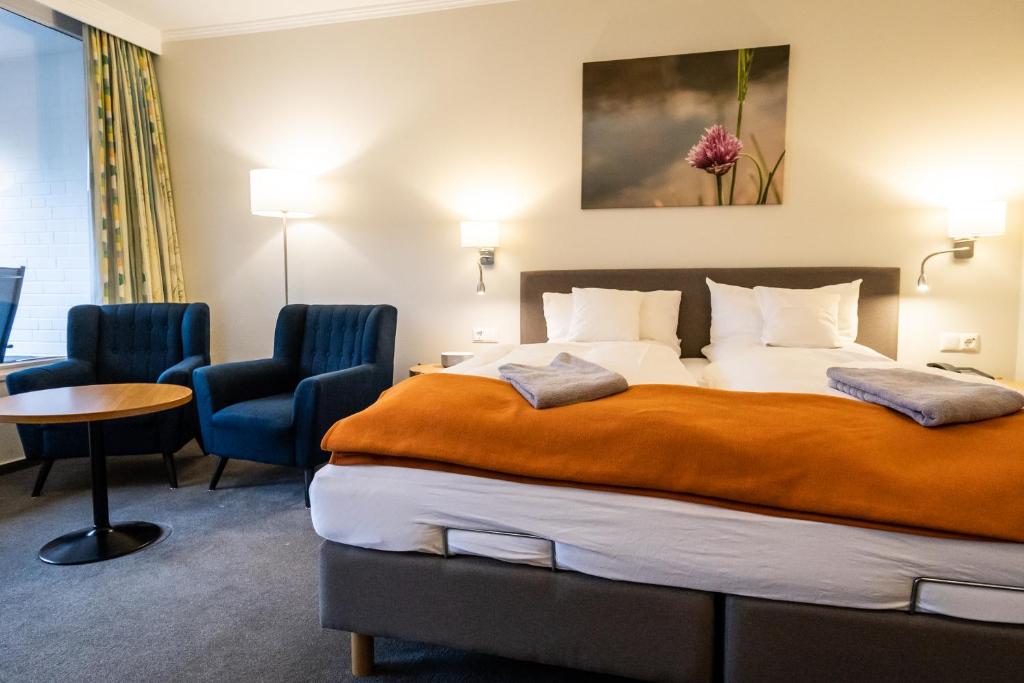 Postel nebo postele na pokoji v ubytování VitalHotel Ascona