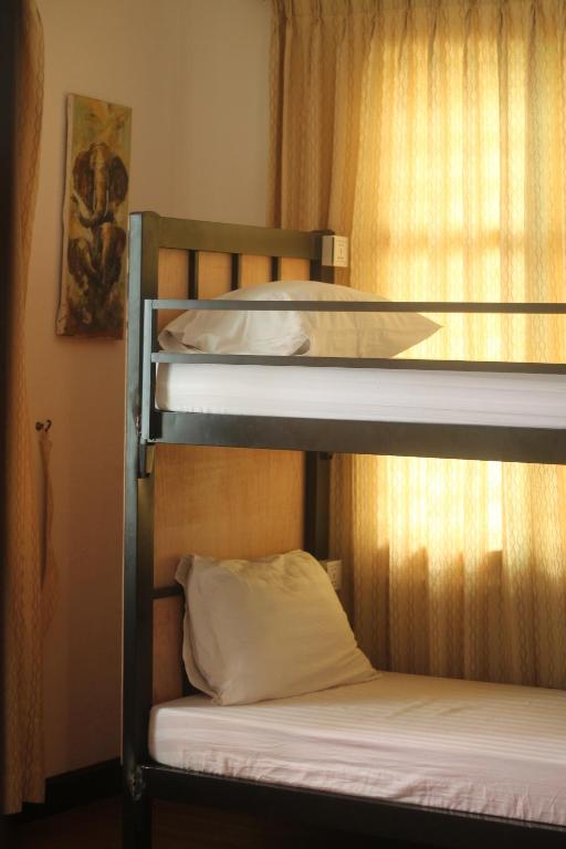Postel nebo postele na pokoji v ubytování Villa Papillon