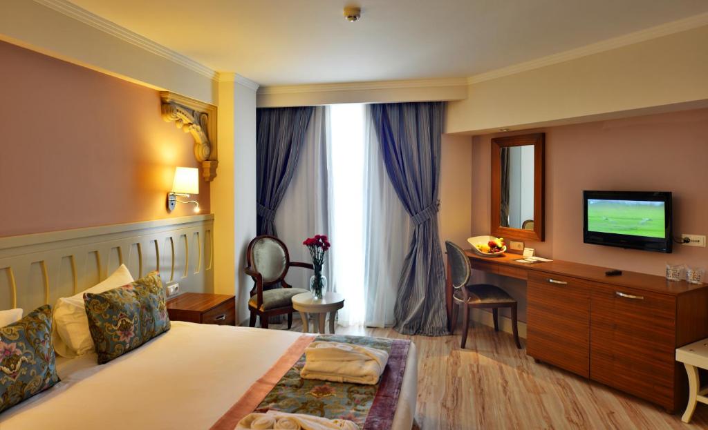 Postel nebo postele na pokoji v ubytování Side Crown Serenity Ultra All Inclusive