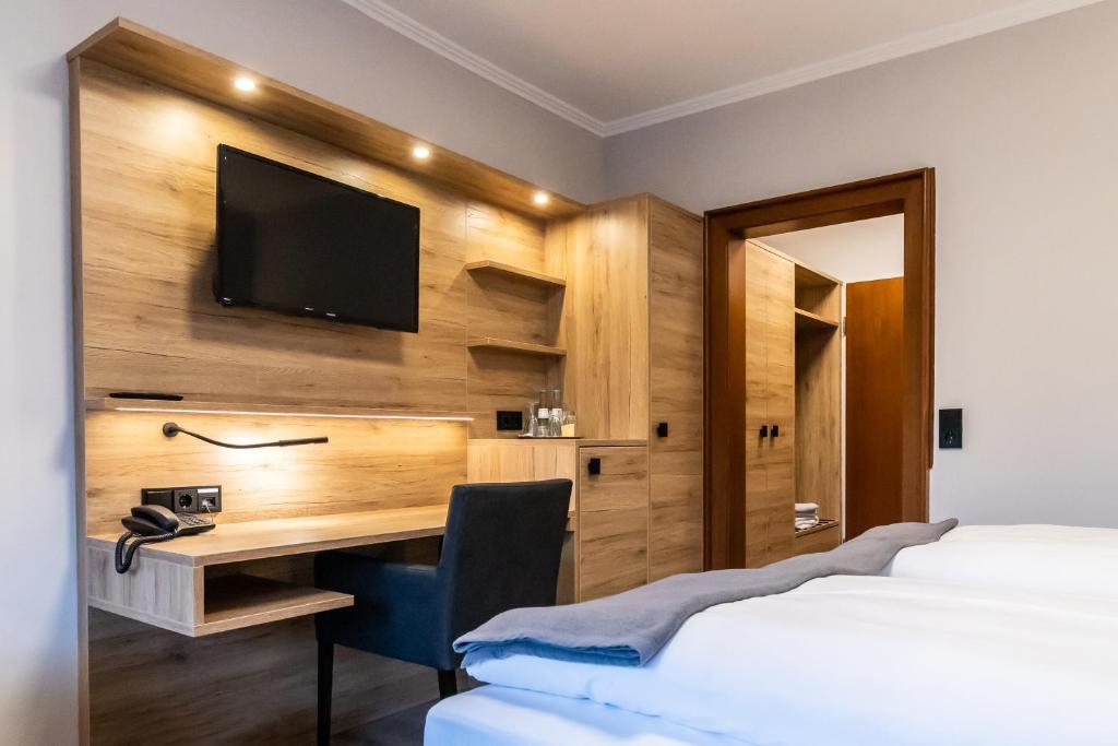 Postel nebo postele na pokoji v ubytování VitalHotel Ascona