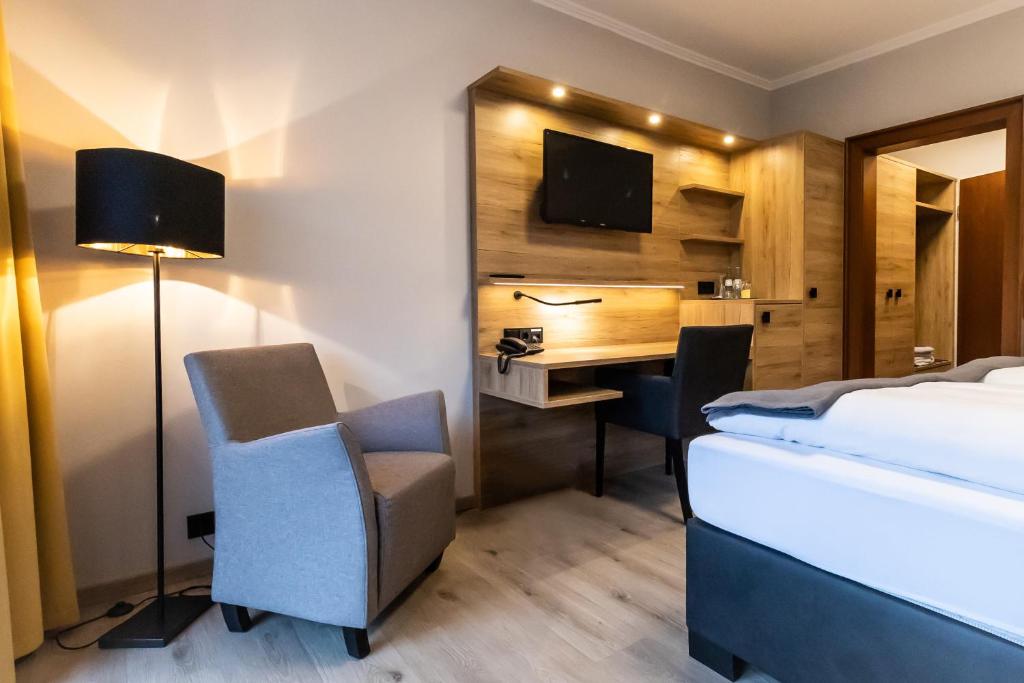 Postel nebo postele na pokoji v ubytování VitalHotel Ascona