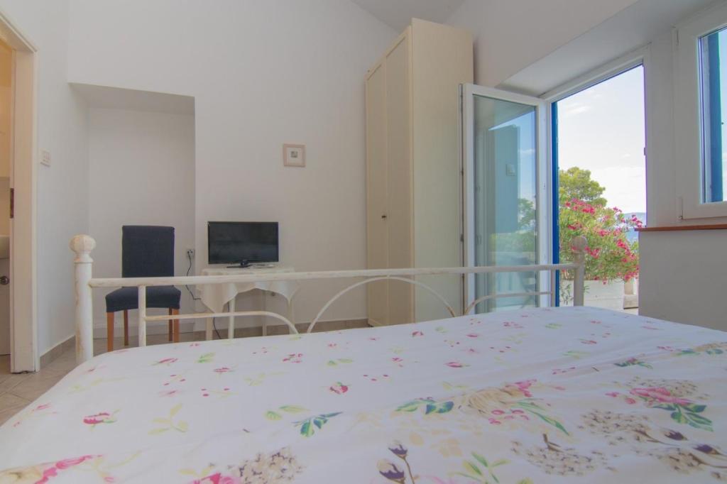 Posteľ alebo postele v izbe v ubytovaní Apartments Dunato Nedeljko