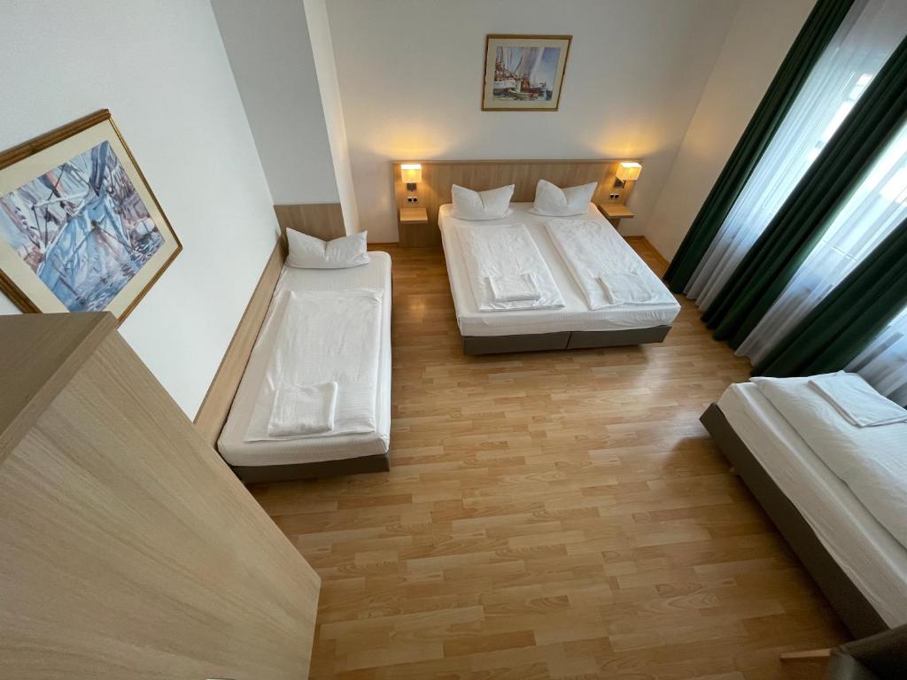 Postel nebo postele na pokoji v ubytování Hafner Hotel Apartment Self Check-In Anytime