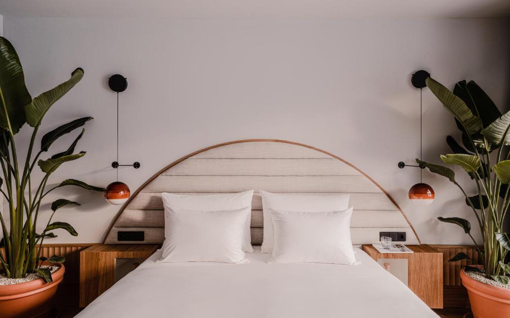 Postel nebo postele na pokoji v ubytování The Comodo Bad Gastein, a Member of Design Hotels