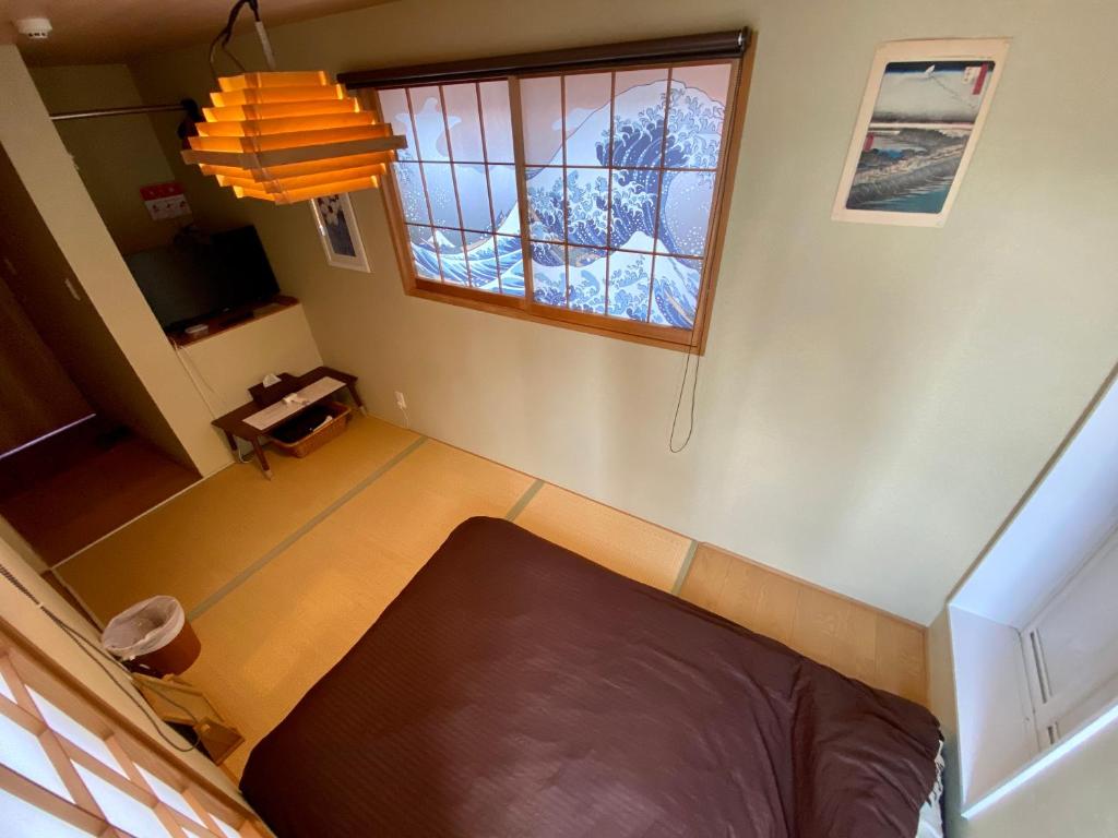 Postel nebo postele na pokoji v ubytování Hotel EL Shinjuku 6