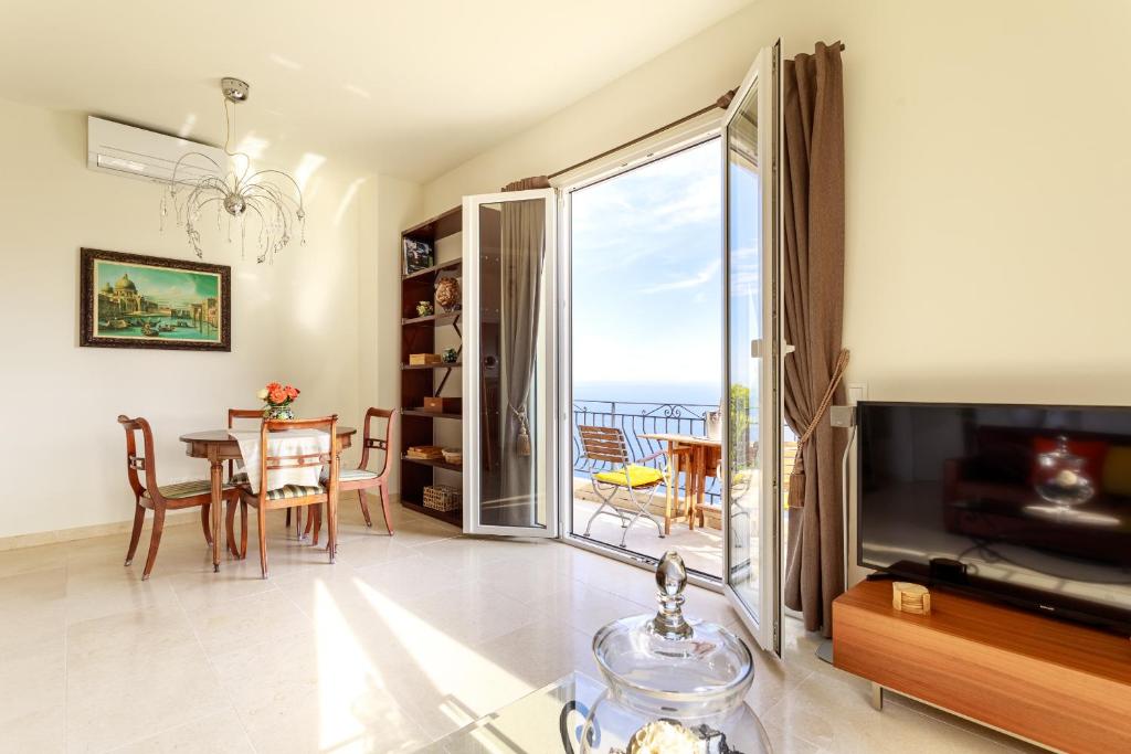 a living room with a view of the ocean at Sea terace apartment between Nice and Monaco - 3 in Villefranche-sur-Mer