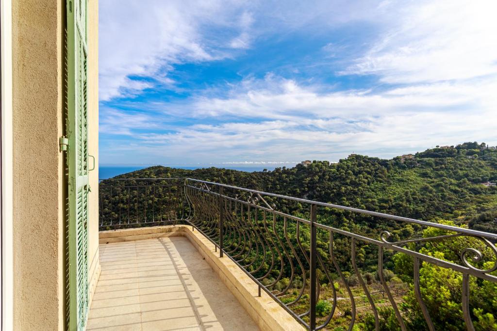 a balcony with a view of the mountains at Sea terace apartment between Nice and Monaco - 3 in Villefranche-sur-Mer