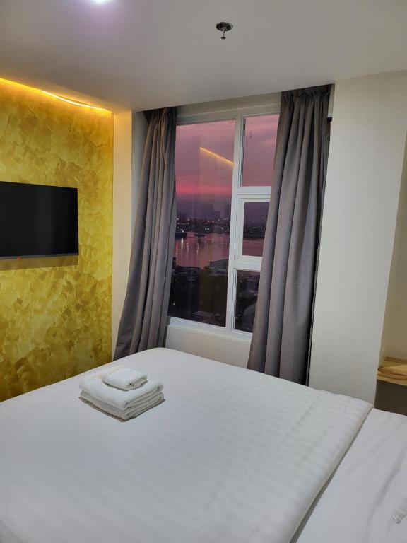 Cama o camas de una habitación en Sempre Premier Inn - MACTAN AIRPORT HOTEL