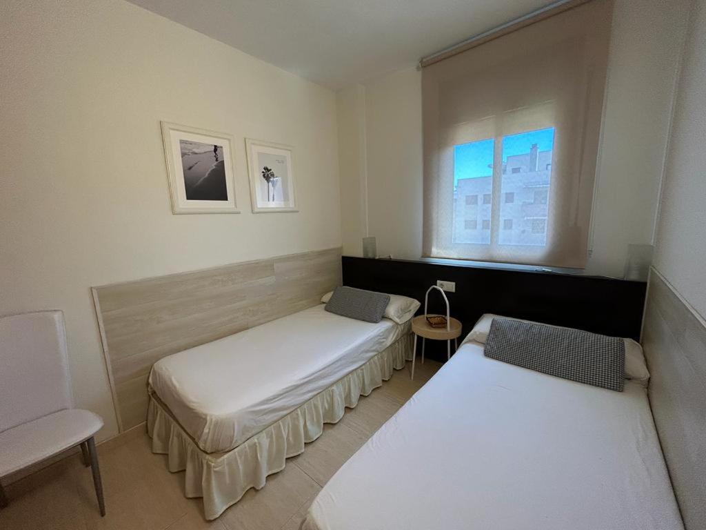 Postel nebo postele na pokoji v ubytování APARTAMENTO LOS GIRASOLES 1