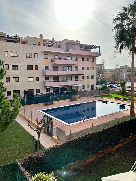 Bazén v ubytování APARTAMENTO LOS GIRASOLES 1 nebo v jeho okolí