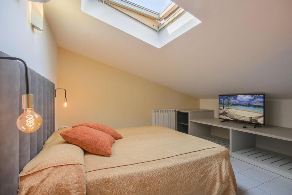 TV a/nebo společenská místnost v ubytování Hotel Tirrenia