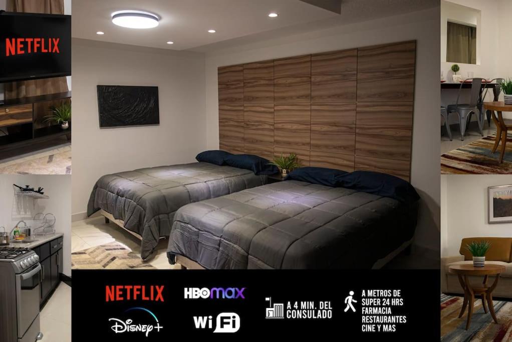 2 camas en un dormitorio con cocina y una habitación en Hermoso depa cerca de consulado, en Ciudad Juárez