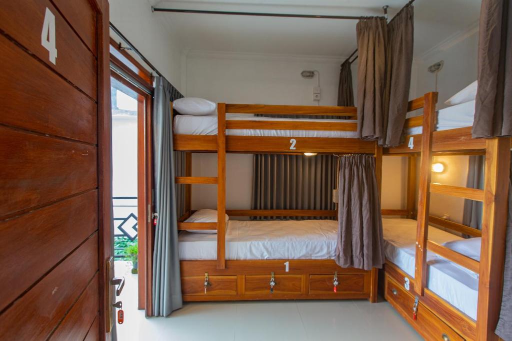 Postel nebo postele na pokoji v ubytování Zentiga Surf Hostel