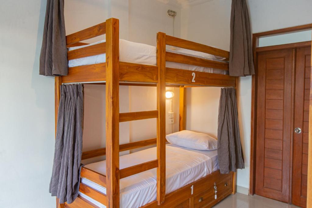Postel nebo postele na pokoji v ubytování Zentiga Surf Hostel