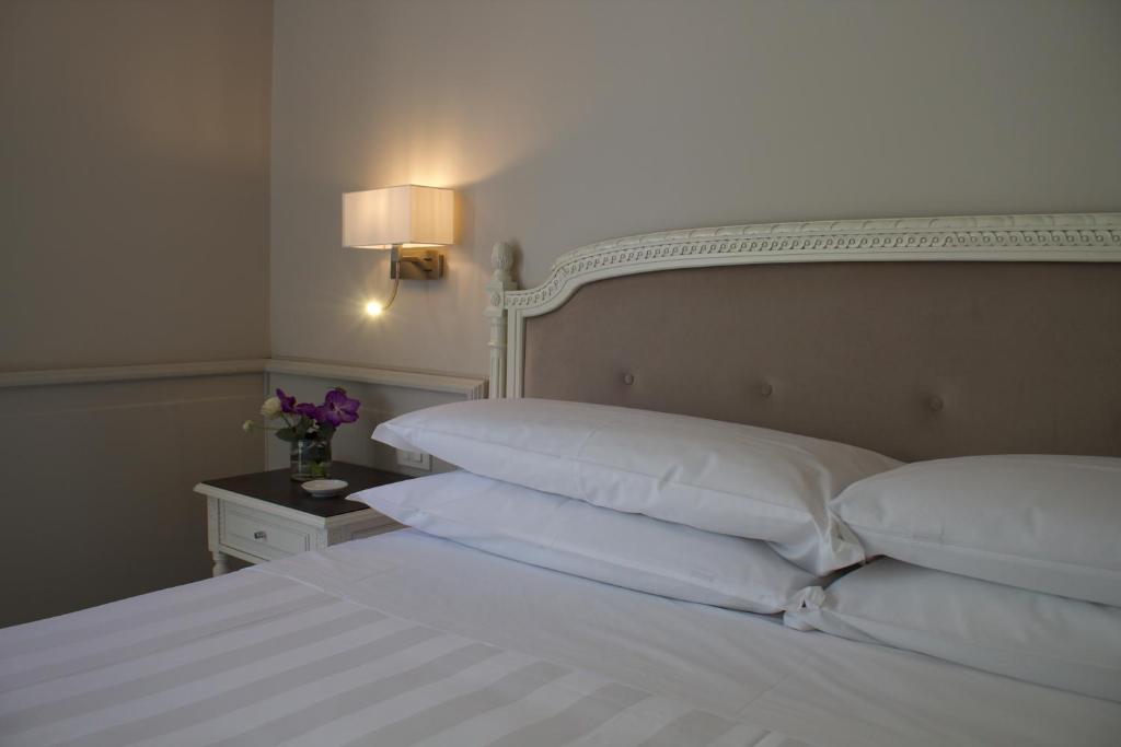Letto o letti in una camera di Parco dei Principi Boutique Hotel
