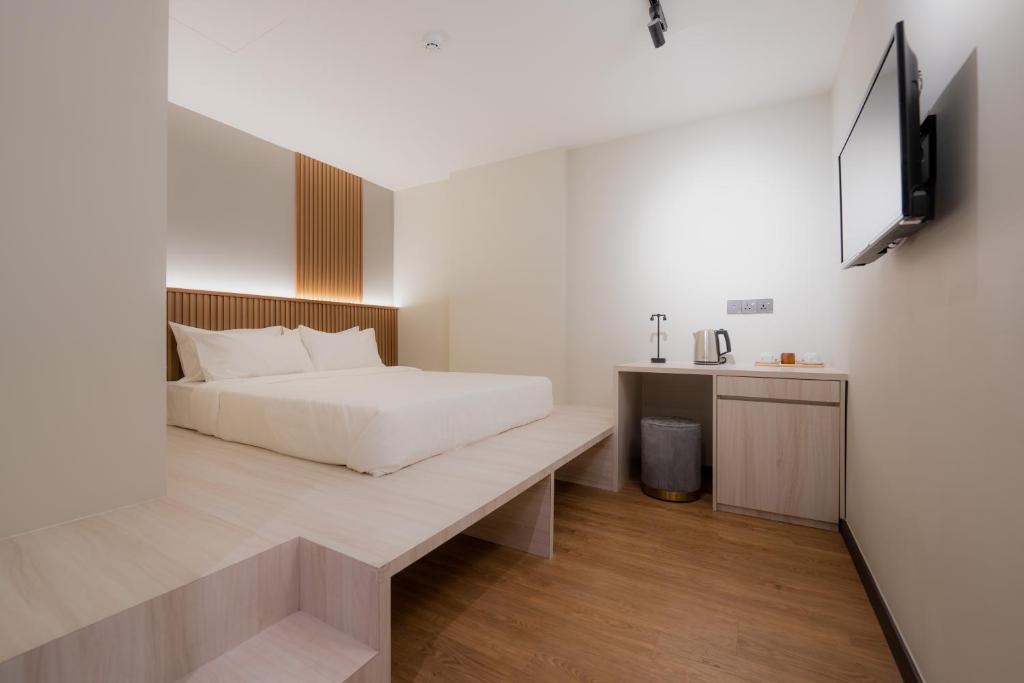 Postel nebo postele na pokoji v ubytování Matata Hotel Kota Kinabalu
