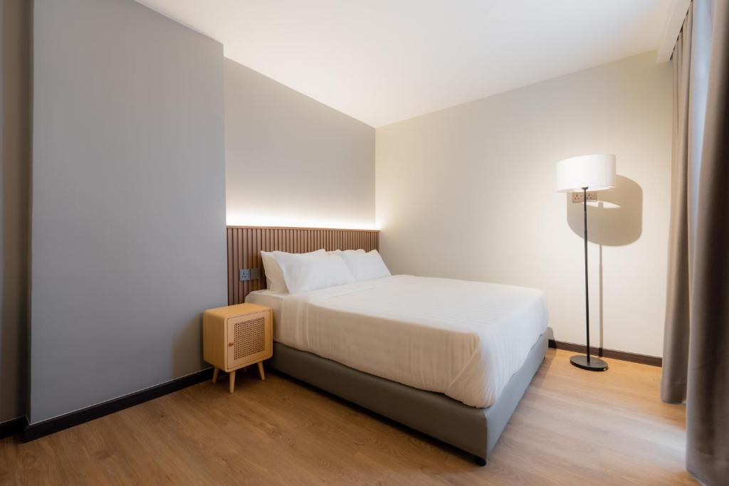 Postel nebo postele na pokoji v ubytování Matata Hotel Kota Kinabalu