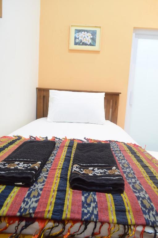 Postel nebo postele na pokoji v ubytování The Cabin Hotel Ambasador