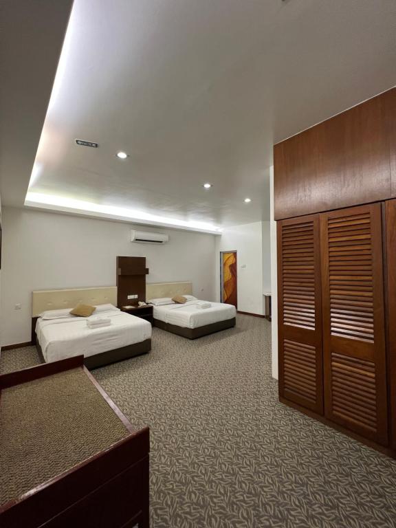 Postel nebo postele na pokoji v ubytování D Eastern Hotel