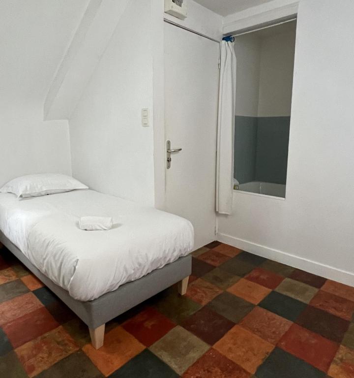 Posteľ alebo postele v izbe v ubytovaní HOTEL KAN AVEL