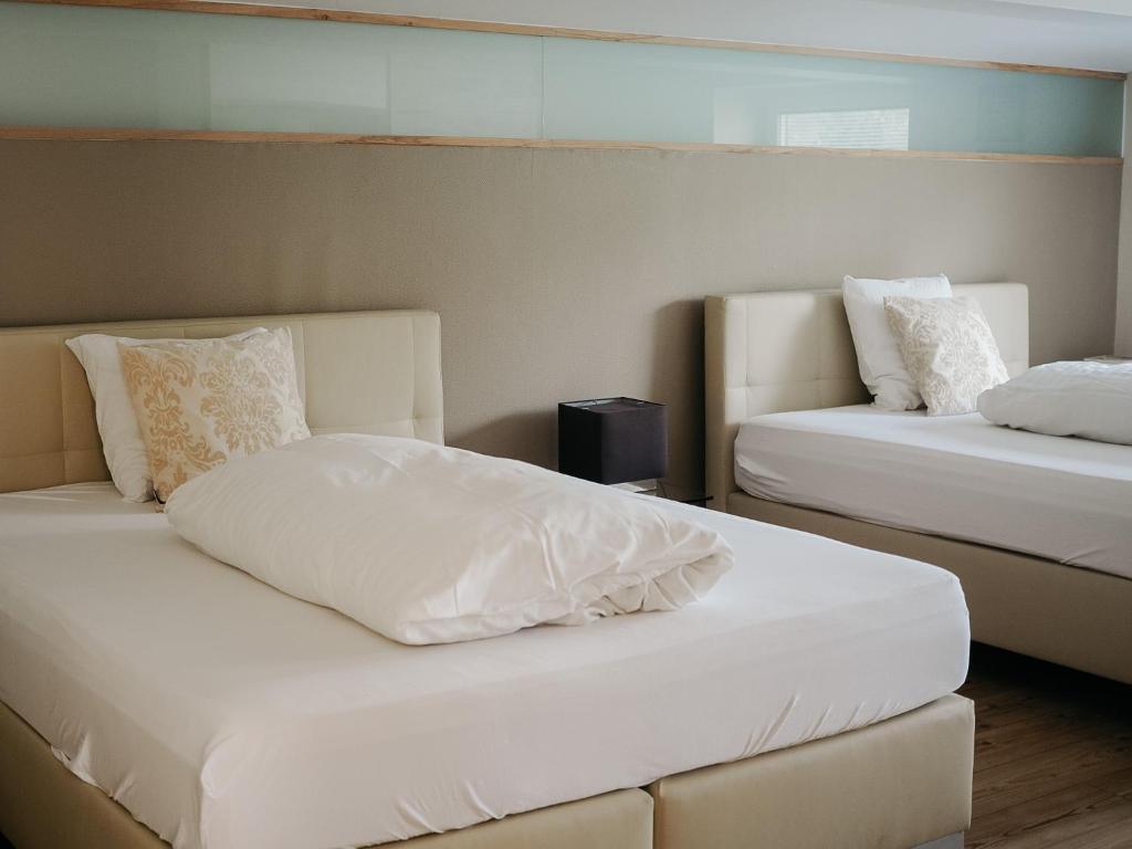 En eller flere senge i et værelse på Appartement Meyer-Ernzen