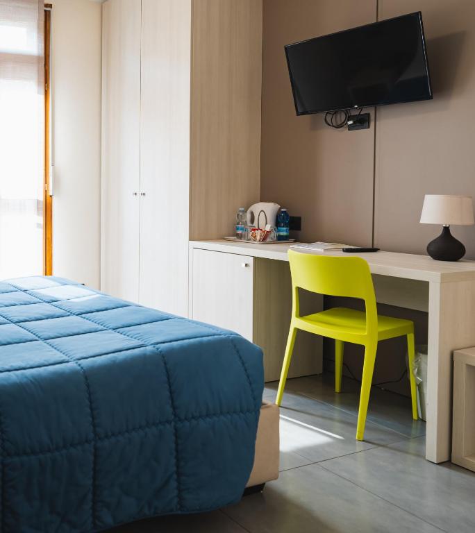 TV a/nebo společenská místnost v ubytování Parini Hotel