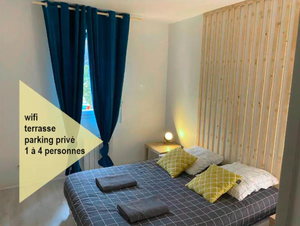 Llit o llits en una habitació de superbe T2 avec parking privé