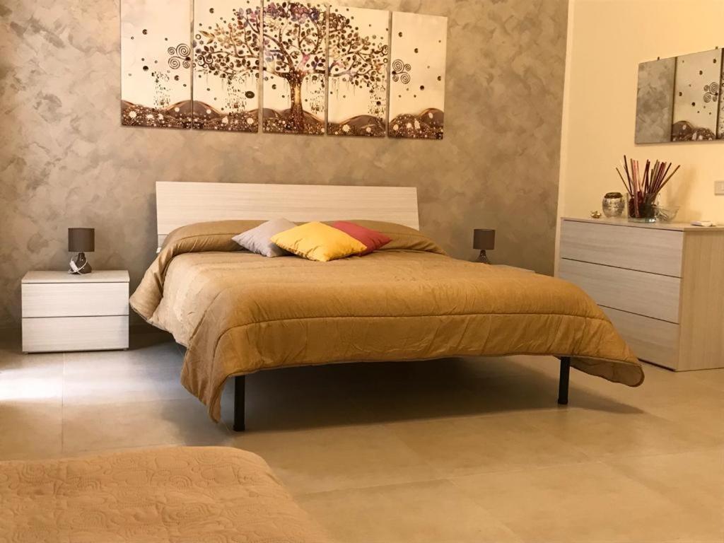 Postel nebo postele na pokoji v ubytování B&B CASA ELISABETTA