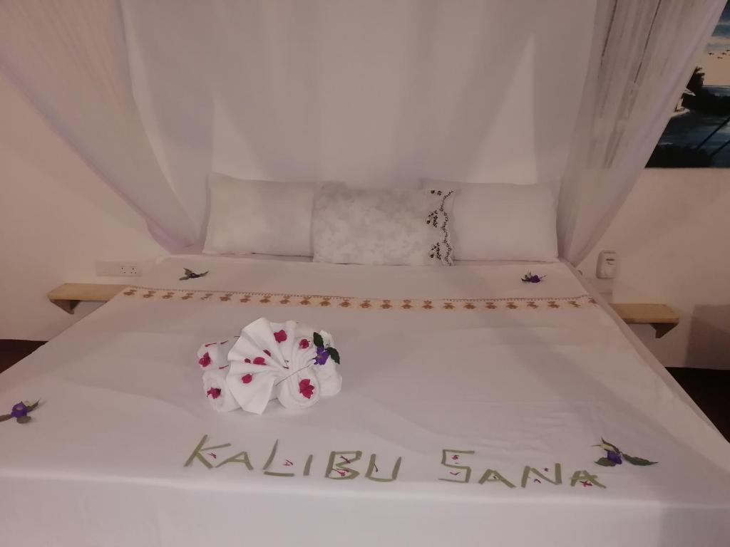 Postel nebo postele na pokoji v ubytování Babalao Rooftop Hotel