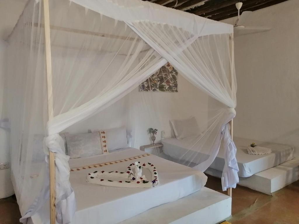 Postel nebo postele na pokoji v ubytování Babalao Rooftop Hotel