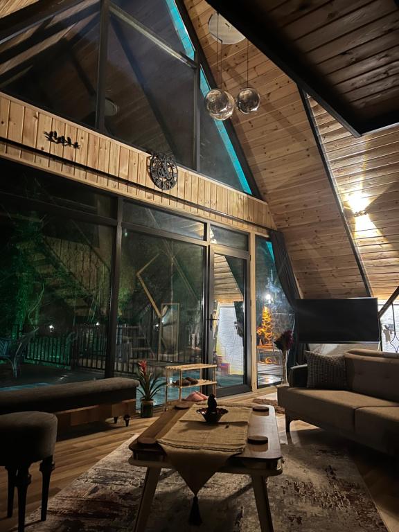 a living room with a couch and a table at İstanbuldere Bungalov in Sapanca